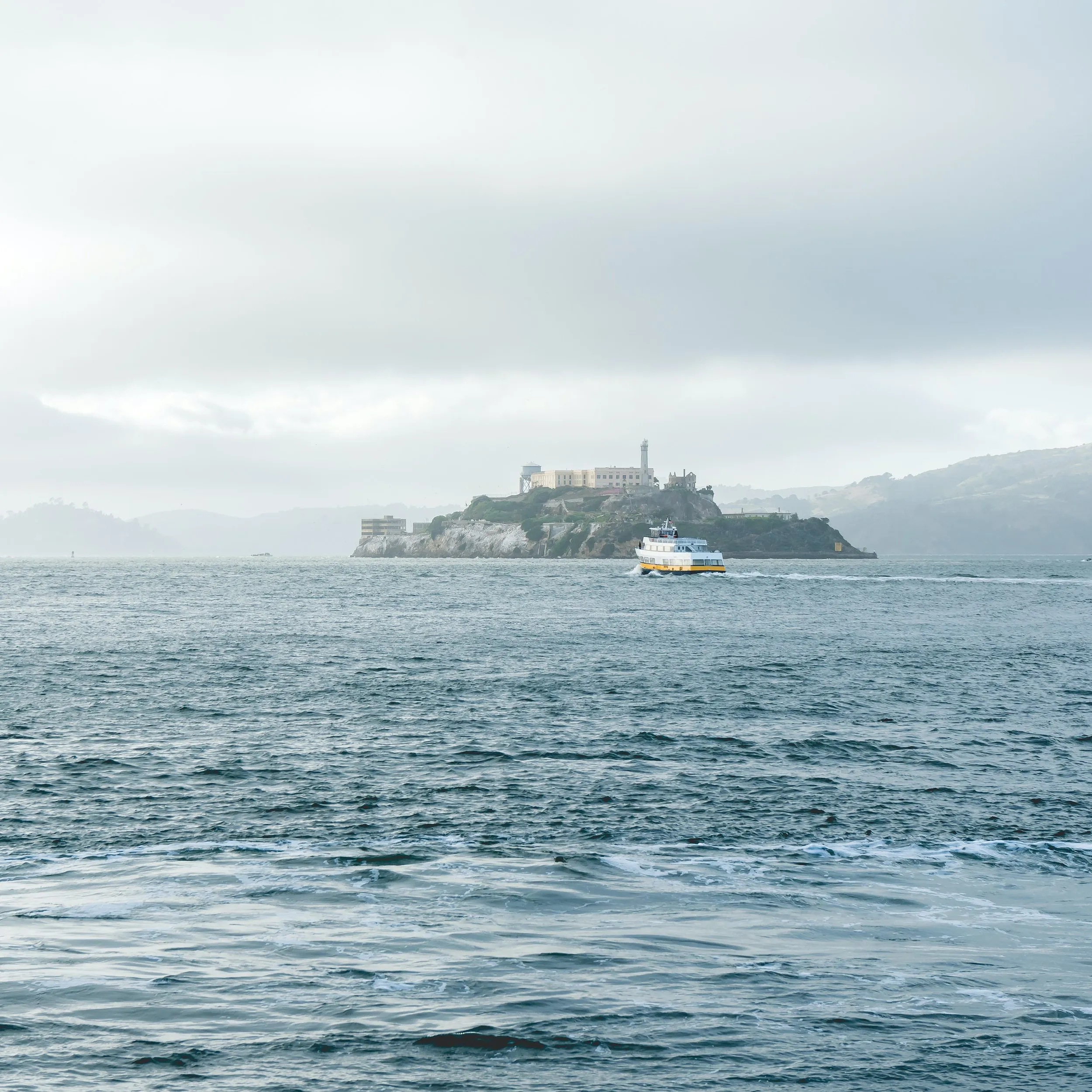 A grey-blue sea near a prison island